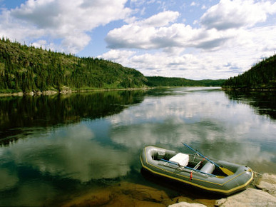 The Serene Water of the Great Whale River Beautifully Reflects the Landscape of Clouds Above